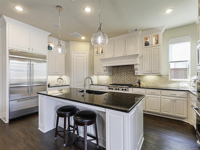 3644 Benchmark Ln, Frisco, TX 75034 - kitchen with stainless steel appliances, white cabinets, backsplash, glass insert cabinets, and recessed lighting