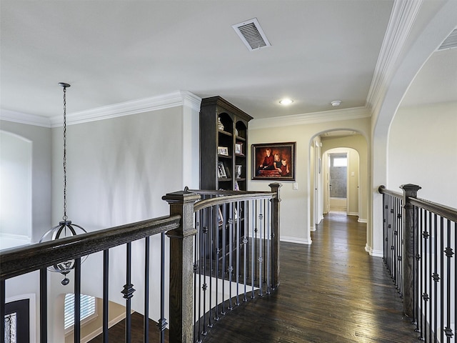 3644 Benchmark Ln, Frisco, TX 75034 - corridor with an upstairs landing, arched walkways, ornamental molding, and dark wood-style floors