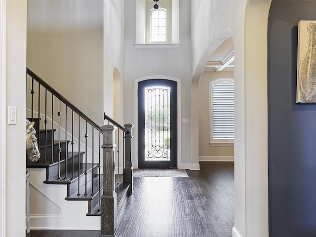 3644 Benchmark Ln, Frisco, TX 75034 - entryway featuring arched walkways, wood finished floors, a high ceiling, and stairway