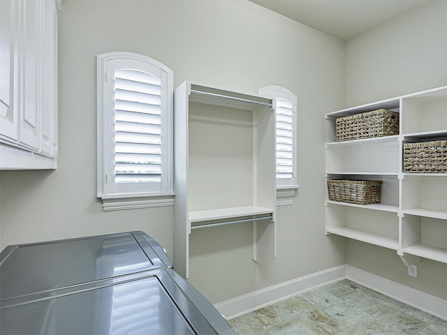 3644 Benchmark Ln, Frisco, TX 75034 - washroom featuring separate washer and dryer, cabinet space, and healthy amount of natural light