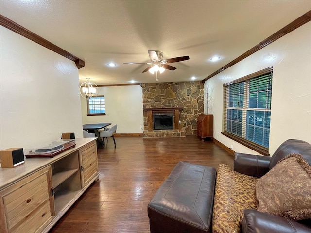 1635 W Pentagon Pkwy, Dallas, TX 75224 - living area with crown molding, a ceiling fan, dark wood-style flooring, a stone fireplace, and recessed lighting