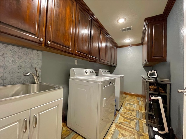 1635 W Pentagon Pkwy, Dallas, TX 75224 - laundry room featuring independent washer and dryer, crown molding, cabinet space, and baseboards