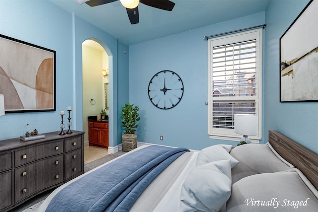 437 Monarch Hill Ct, Keller, TX 76248 - bedroom with arched walkways, ensuite bath, and ceiling fan