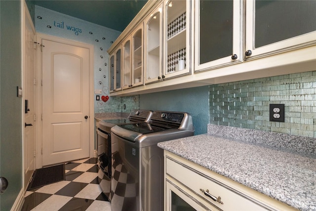 437 Monarch Hill Ct, Keller, TX 76248 - laundry room with washing machine and dryer, light flooring, and cabinet space