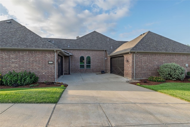 437 Monarch Hill Ct, Keller, TX 76248 - view of front of home featuring a shingled roof, a garage, concrete driveway, and brick siding