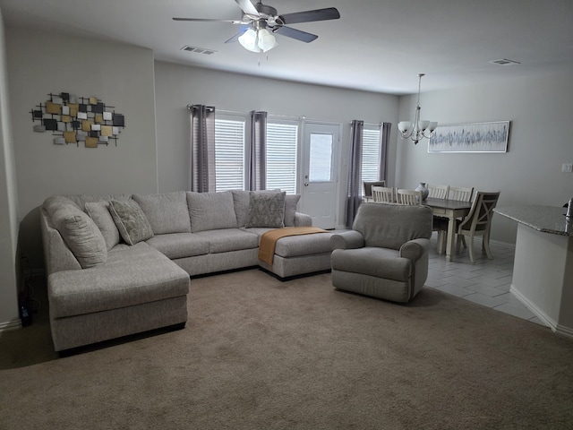 324 Lead Creek Dr, Fort Worth, TX 76131 - carpeted living room featuring a chandelier, a ceiling fan, baseboards, and tile patterned floors