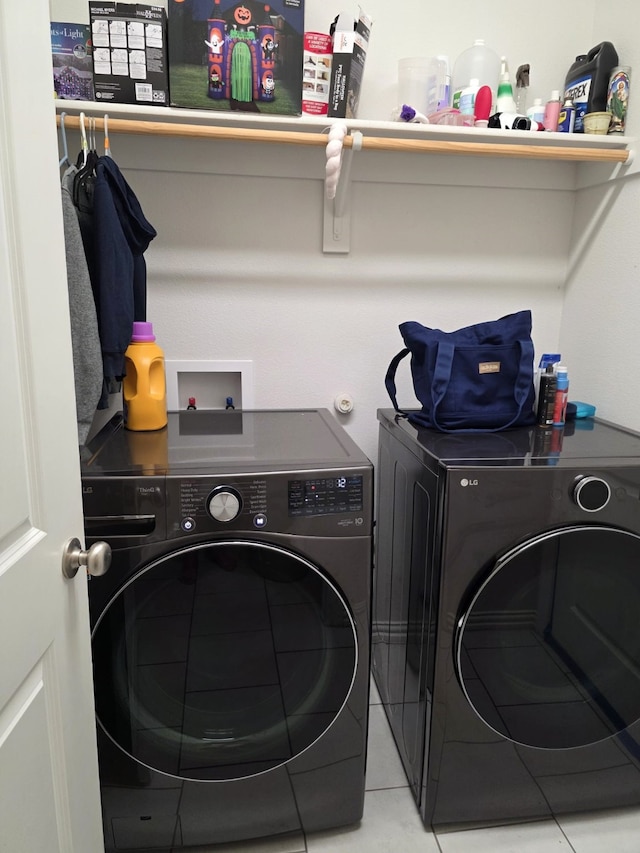 324 Lead Creek Dr, Fort Worth, TX 76131 - laundry room with washer and clothes dryer and light tile patterned flooring
