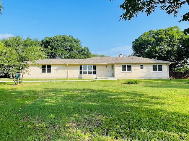 2917 Hickox Rd, Rowlett, TX 75089 - back of house with a yard and a chimney