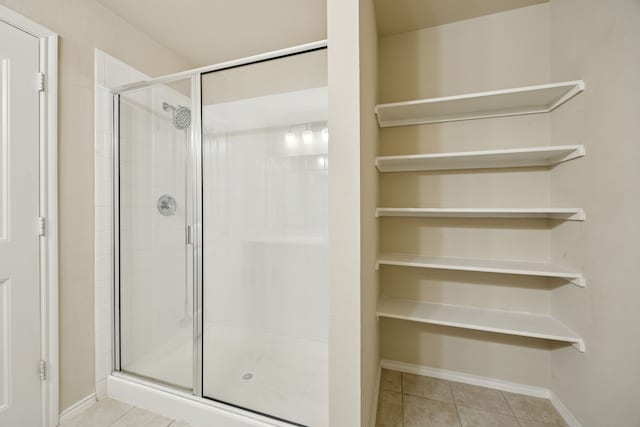 1035 Sadie St, Forney, TX 75126 - full bath with a shower stall, tile patterned flooring, and baseboards