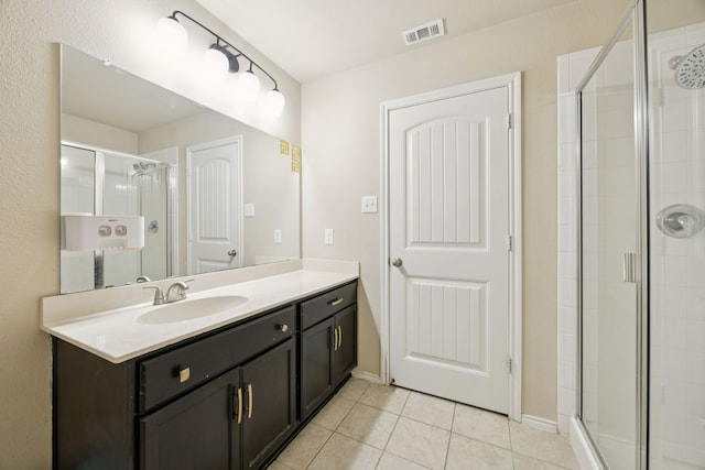 1035 Sadie St, Forney, TX 75126 - bathroom featuring tile patterned flooring, vanity, a shower stall, and baseboards
