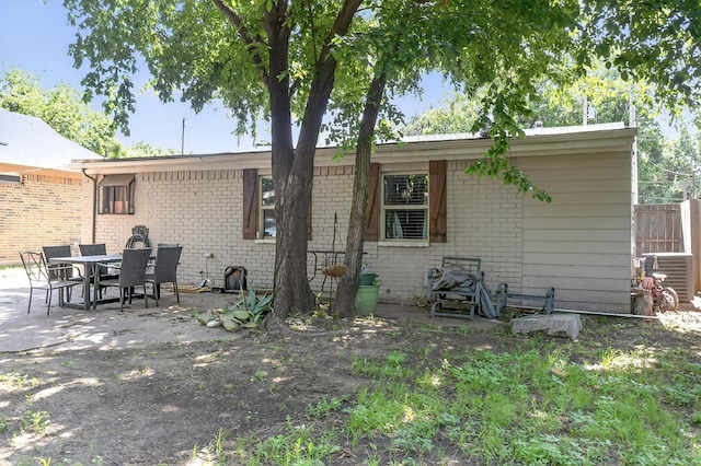 2226 Varsity Dr, Grand Prairie, TX 75051 - back of house featuring brick siding, a patio area, and cooling unit