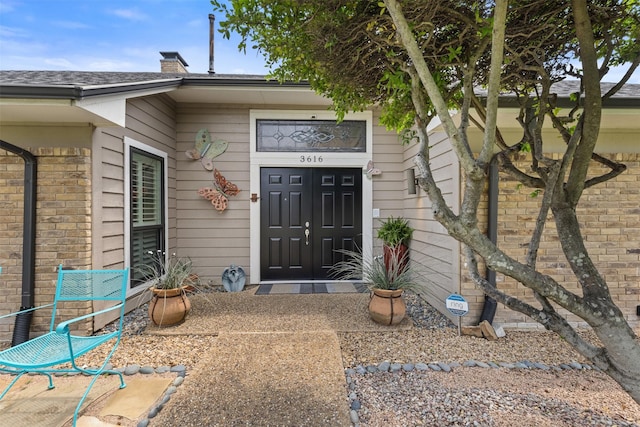 3616 Wandering Trl, Plano, TX 75075 - doorway to property featuring a chimney and brick siding