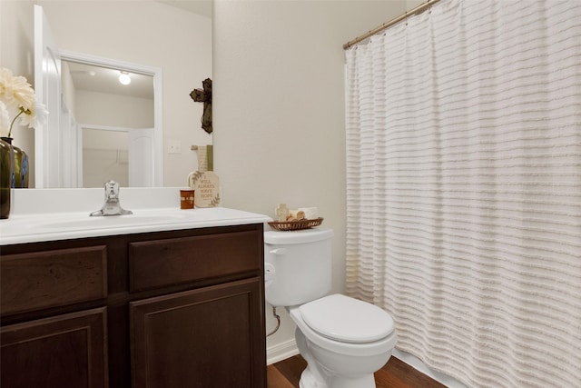 1303 Clegg St, Howe, TX 75459 - bathroom featuring vanity, toilet, a shower with curtain, and wood finished floors