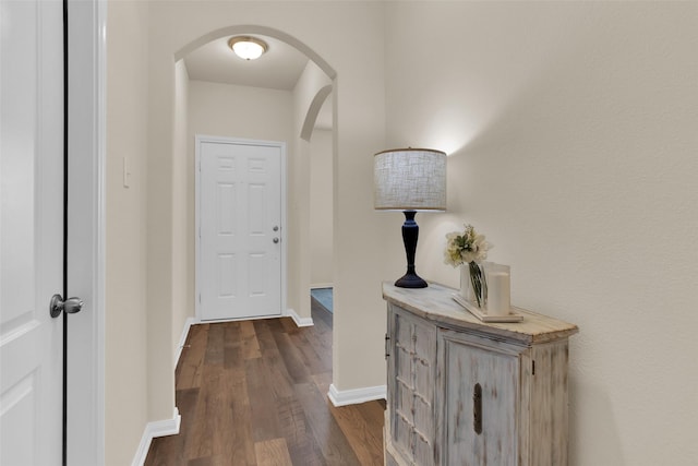 1303 Clegg St, Howe, TX 75459 - hall with arched walkways, dark wood finished floors, and baseboards