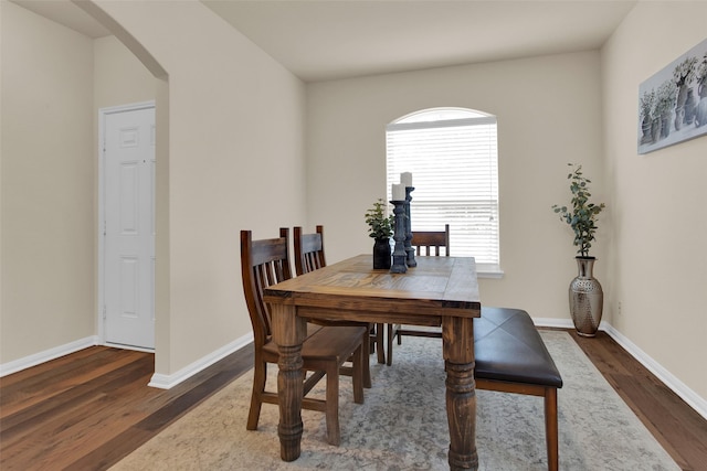 1303 Clegg St, Howe, TX 75459 - dining space with arched walkways, wood finished floors, and baseboards