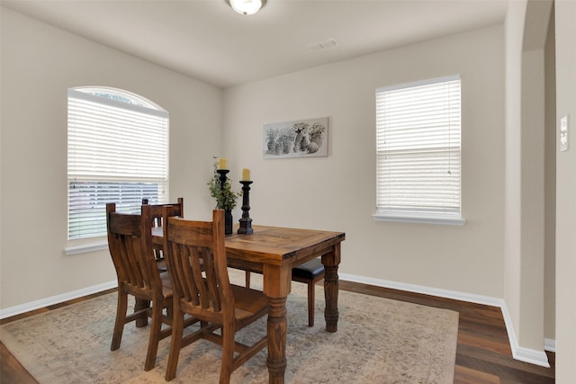 1303 Clegg St, Howe, TX 75459 - dining space featuring healthy amount of natural light, baseboards, wood finished floors, and arched walkways