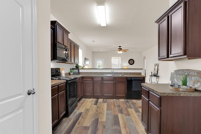 1303 Clegg St, Howe, TX 75459 - kitchen featuring black appliances, a sink, a peninsula, ceiling fan, and light wood-style flooring