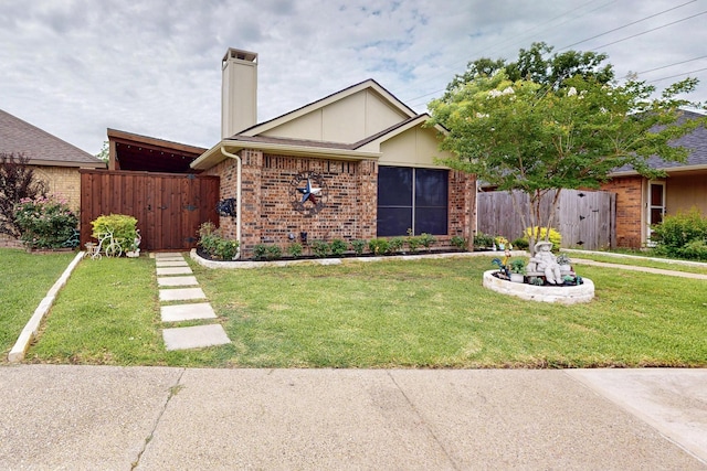 1708 Wheatfield Dr, Mesquite, TX 75149 - view of front of property with brick siding, a chimney, and a gate