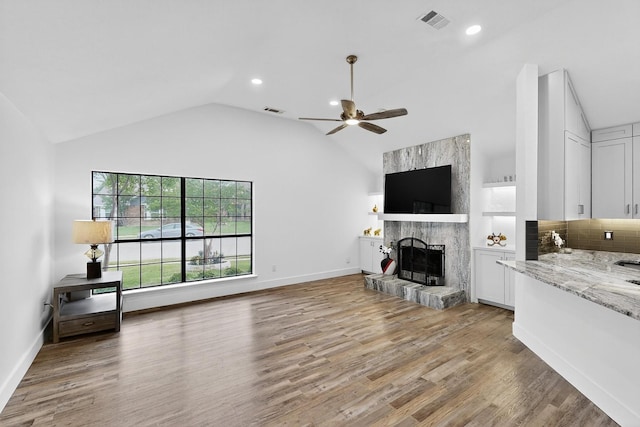 1708 Wheatfield Dr, Mesquite, TX 75149 - living room with a ceiling fan, a fireplace, light wood finished floors, recessed lighting, and baseboards