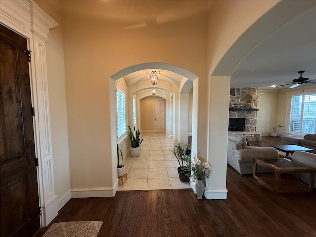 321 Bear Country Dr, Aledo, TX 76008 - foyer entrance with wood finished floors, a ceiling fan, baseboards, and arched walkways