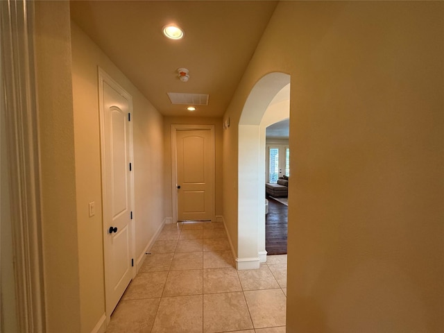 321 Bear Country Dr, Aledo, TX 76008 - corridor featuring arched walkways, recessed lighting, light tile patterned floors, and baseboards