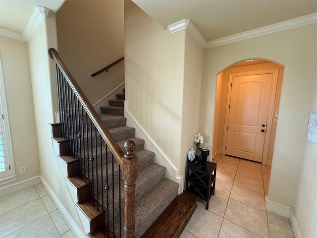 321 Bear Country Dr, Aledo, TX 76008 - entrance foyer with crown molding, tile patterned flooring, arched walkways, and stairway