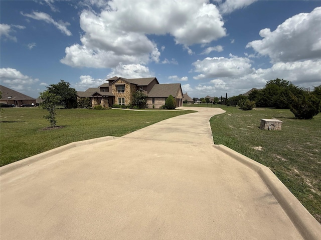 321 Bear Country Dr, Aledo, TX 76008 - view of front of house featuring stone siding, a front yard, and driveway