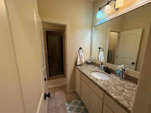 321 Bear Country Dr, Aledo, TX 76008 - bathroom featuring vanity, tile patterned flooring, and a shower with shower door