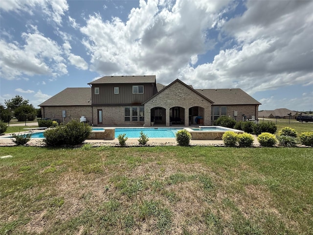 321 Bear Country Dr, Aledo, TX 76008 - rear view of house featuring board and batten siding, brick siding, an outdoor pool, and a lawn