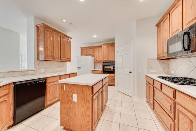 3232 Kent Dr, Flower Mound, TX 75022 - kitchen featuring black appliances, backsplash, a center island, light tile patterned floors, and recessed lighting