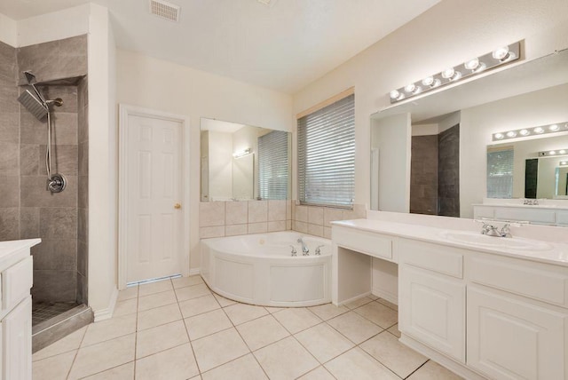 3232 Kent Dr, Flower Mound, TX 75022 - bathroom with tile patterned floors, a garden tub, tiled shower, and vanity