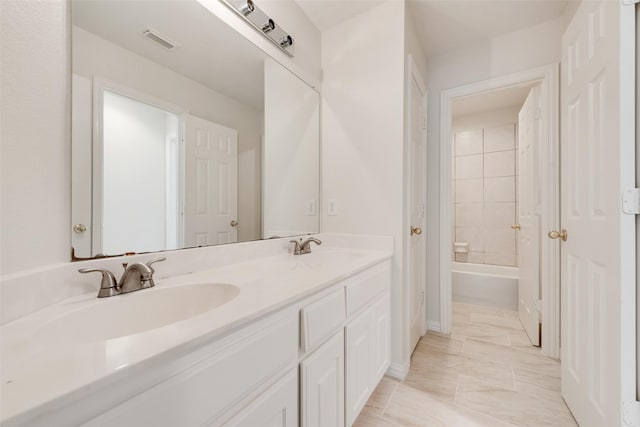 3232 Kent Dr, Flower Mound, TX 75022 - full bath featuring double vanity, marble finish flooring, and washtub / shower combination