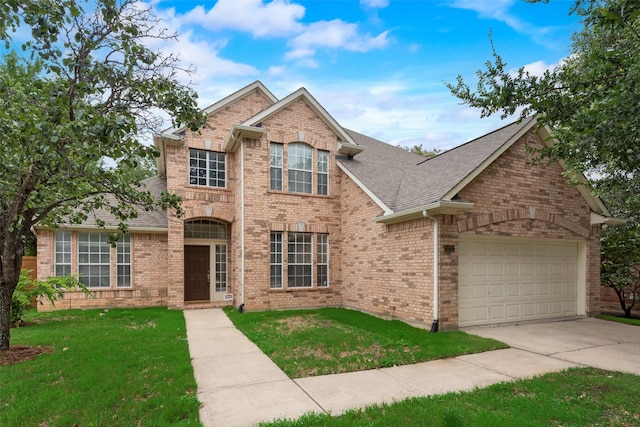 3232 Kent Dr, Flower Mound, TX 75022 - traditional-style home featuring brick siding, driveway, a front lawn, and roof with shingles