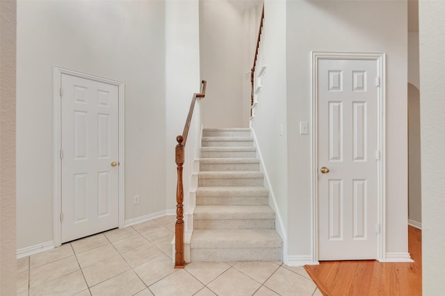 3232 Kent Dr, Flower Mound, TX 75022 - stairs featuring tile patterned floors and arched walkways