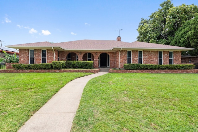 110 S Capri Dr, Duncanville, TX 75116 - ranch-style house featuring a chimney, a front lawn, brick siding, and roof with shingles