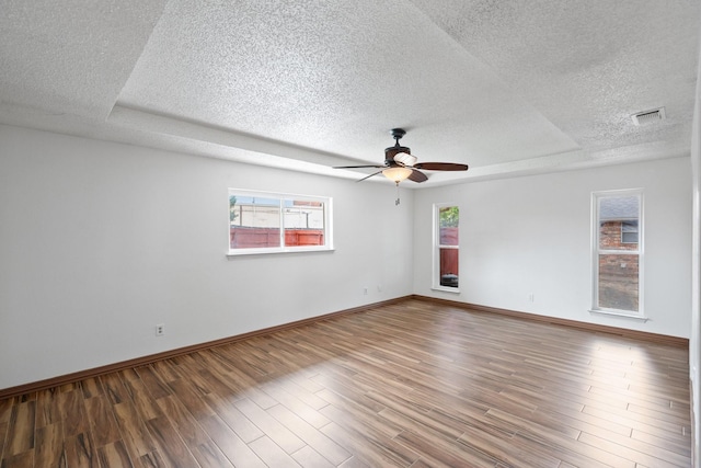 110 S Capri Dr, Duncanville, TX 75116 - unfurnished room featuring a textured ceiling, a ceiling fan, and wood finished floors