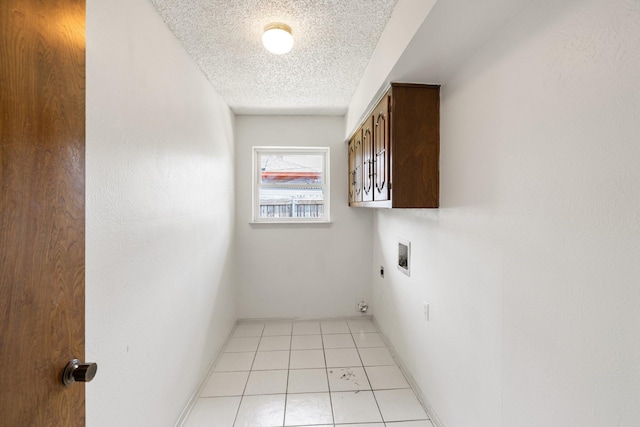 110 S Capri Dr, Duncanville, TX 75116 - laundry area with cabinet space, hookup for an electric dryer, hookup for a washing machine, and a textured ceiling
