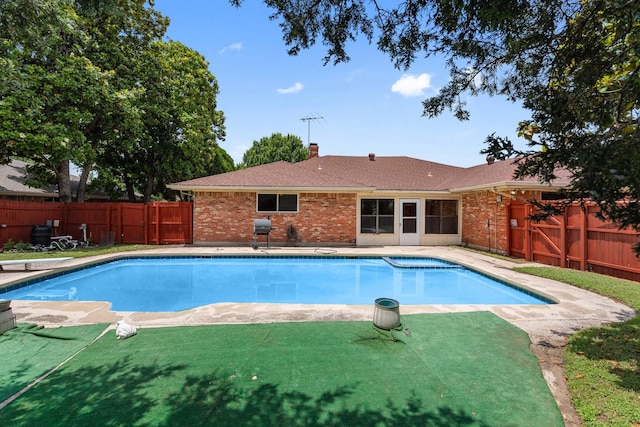 110 S Capri Dr, Duncanville, TX 75116 - view of swimming pool featuring a fenced backyard, a diving board, and area for grilling
