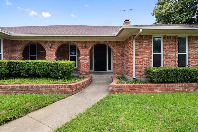 110 S Capri Dr, Duncanville, TX 75116 - view of front of property with a chimney, a shingled roof, a front lawn, and brick siding