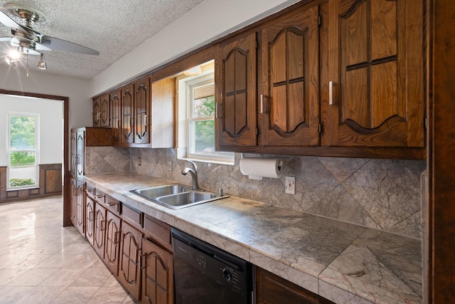 110 S Capri Dr, Duncanville, TX 75116 - kitchen featuring black dishwasher, ceiling fan, healthy amount of natural light, backsplash, and a textured ceiling