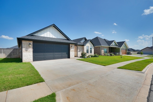 207 Morning Mist Trl, Abilene, TX 79602 - view of front facade with board and batten siding, concrete driveway, an attached garage, and brick siding