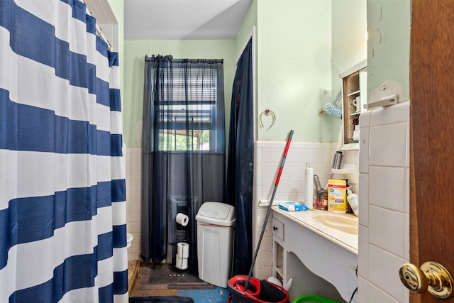 303 E Broadway St, Prosper, TX 75078 - full bath with tile walls, vanity, a wainscoted wall, and toilet