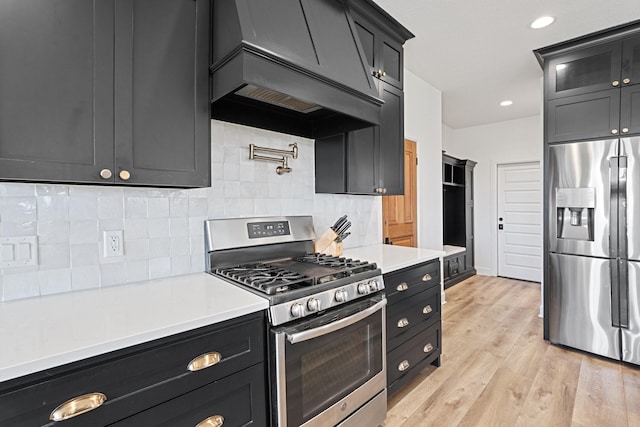 7954 Lax Dr, Fort Worth, TX 76126 - kitchen featuring appliances with stainless steel finishes, custom exhaust hood, light countertops, decorative backsplash, and recessed lighting