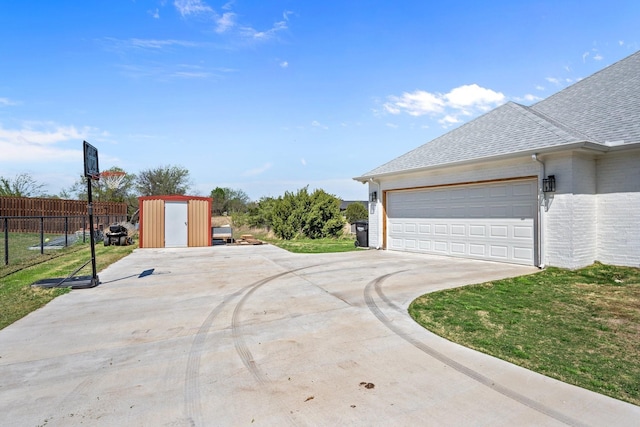 7954 Lax Dr, Fort Worth, TX 76126 - garage featuring a storage unit and concrete driveway