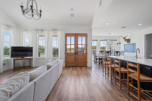 7954 Lax Dr, Fort Worth, TX 76126 - living area with a chandelier, wood finished floors, recessed lighting, lofted ceiling, and baseboards