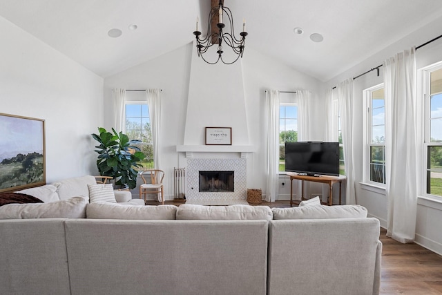 7954 Lax Dr, Fort Worth, TX 76126 - living room featuring wood finished floors, plenty of natural light, a tile fireplace, high vaulted ceiling, and baseboards
