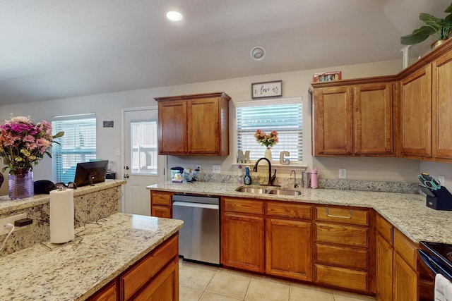 337 Grace Cir, Hurst, TX 76053 - kitchen with stainless steel dishwasher, a sink, healthy amount of natural light, brown cabinetry, and recessed lighting