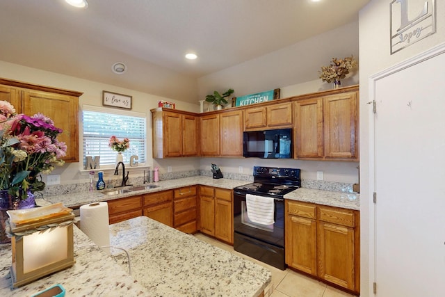 337 Grace Cir, Hurst, TX 76053 - kitchen with black appliances, a sink, light stone countertops, recessed lighting, and brown cabinetry