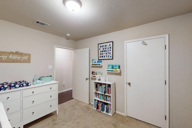 337 Grace Cir, Hurst, TX 76053 - bedroom with light colored carpet and a textured ceiling