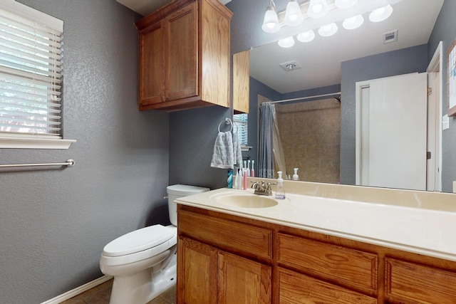 337 Grace Cir, Hurst, TX 76053 - full bathroom featuring a textured wall, toilet, vanity, a shower with curtain, and tile patterned flooring
